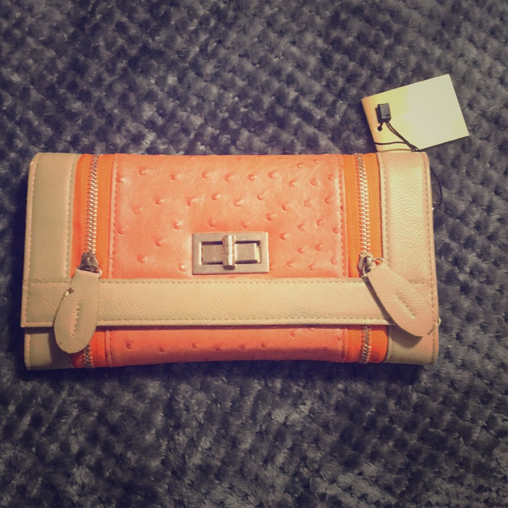 Francesca’s orange two zip clutch